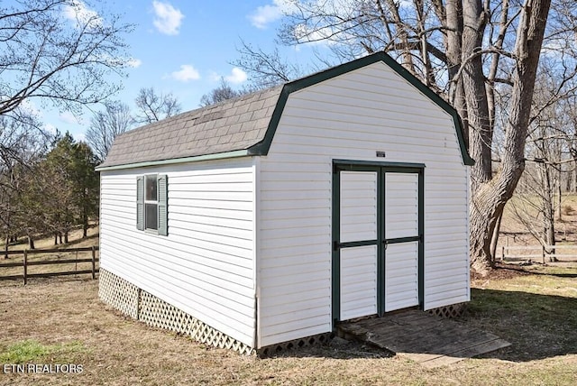 view of shed with fence