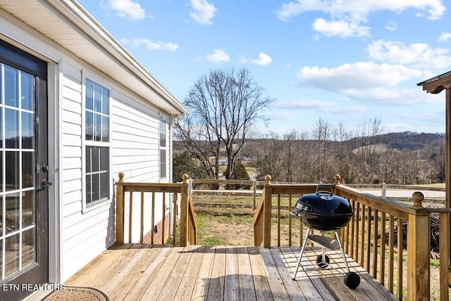 wooden terrace with area for grilling