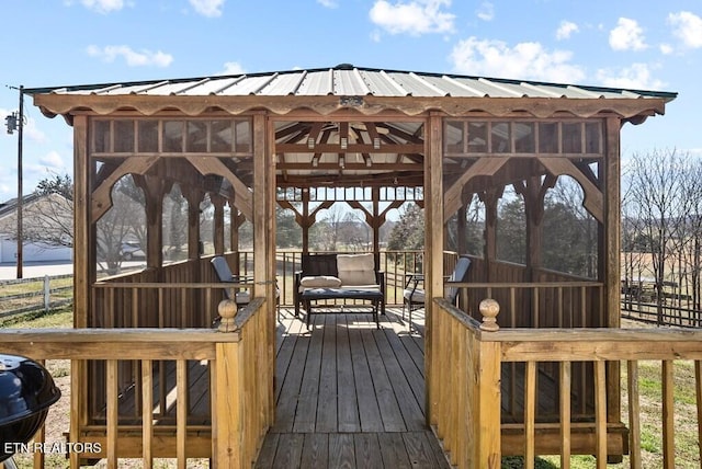 deck featuring a gazebo and a grill