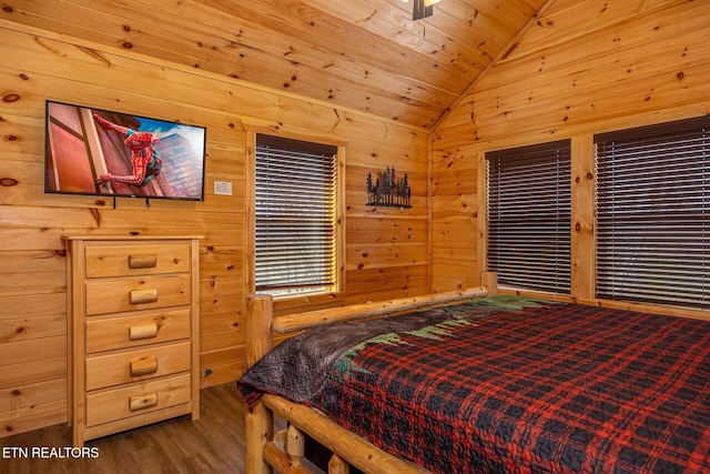 bedroom featuring wooden ceiling, vaulted ceiling, wooden walls, and wood finished floors