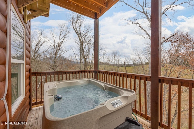 deck featuring a hot tub