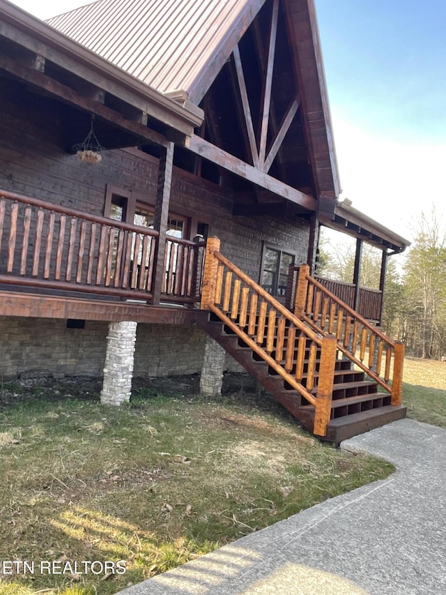 view of property exterior featuring a porch and a yard