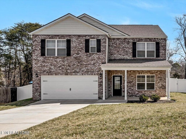 traditional home featuring driveway, a garage, fence, and a front lawn