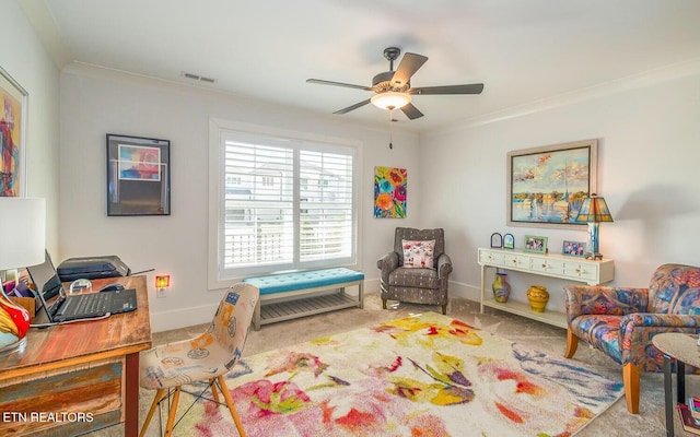 interior space featuring carpet floors, a ceiling fan, visible vents, baseboards, and crown molding