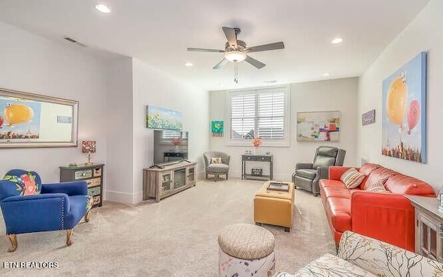 carpeted living area with visible vents, a ceiling fan, and recessed lighting