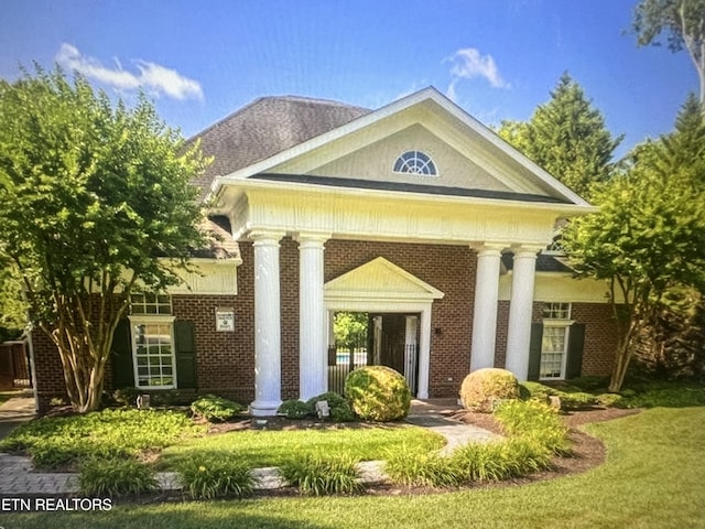 exterior space with brick siding