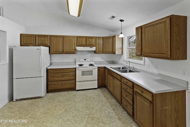 kitchen with white appliances, visible vents, brown cabinets, under cabinet range hood, and a sink