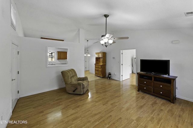 living room featuring light wood-style floors, visible vents, baseboards, and a ceiling fan