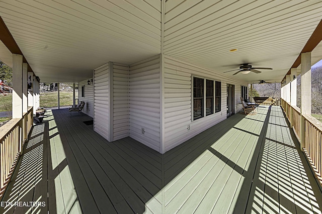 deck with a porch and a ceiling fan