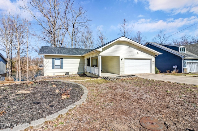 ranch-style home with a porch, crawl space, concrete driveway, and a garage