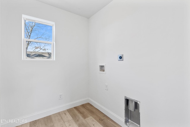 laundry area featuring washer hookup, light wood finished floors, hookup for an electric dryer, laundry area, and baseboards