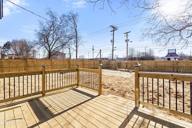 deck with a fenced backyard