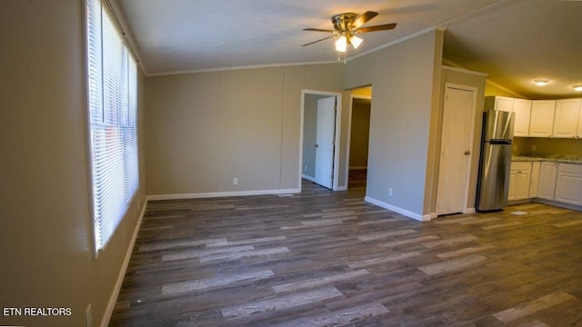 unfurnished living room featuring a ceiling fan, lofted ceiling, dark wood-style flooring, and crown molding