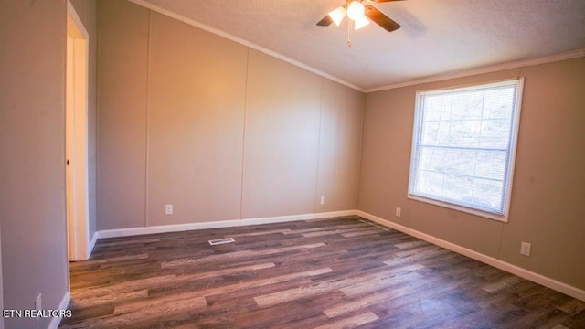 unfurnished room with visible vents, a ceiling fan, dark wood-type flooring, crown molding, and a textured ceiling