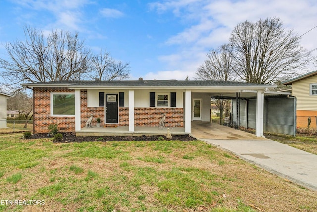 single story home with brick siding, covered porch, crawl space, an attached carport, and a front lawn