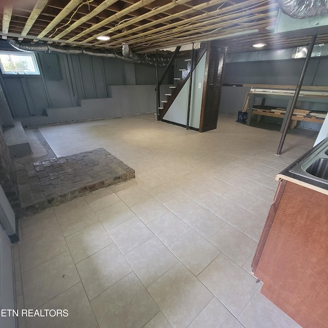 421 Cumberland Ave, Athens, TN 37303 - basement featuring stairway, a sink, and tile patterned floors
