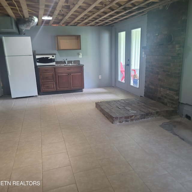 421 Cumberland Ave, Athens, TN 37303 - kitchen with freestanding refrigerator, french doors, a sink, and dark countertops