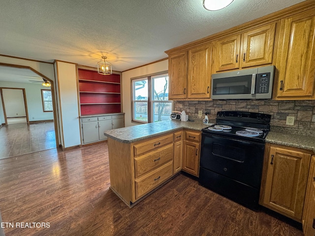 kitchen with dark wood-style floors, stainless steel microwave, black electric range oven, a peninsula, and crown molding