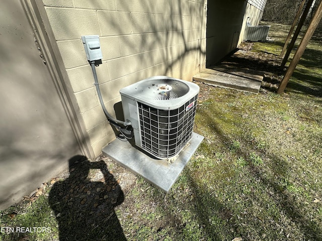 details with concrete block siding and central AC unit