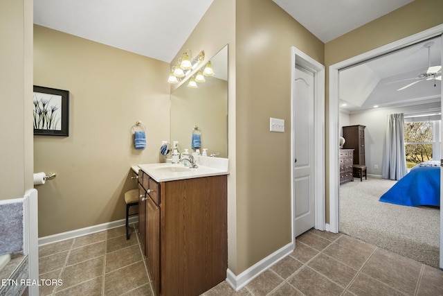 bathroom with vanity, a ceiling fan, baseboards, and tile patterned flooring