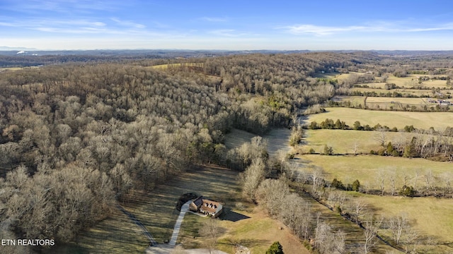 bird's eye view with a rural view and a view of trees