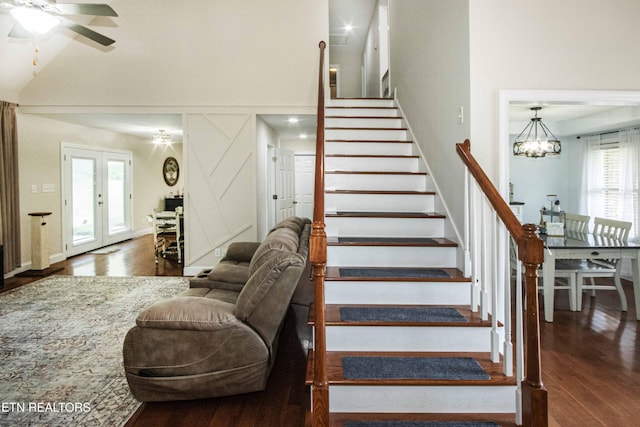 103 Branch Ln, Clinton, TN 37716 - stairs featuring wood finished floors, a ceiling fan, a chandelier, and a high ceiling