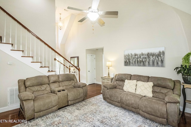 103 Branch Ln, Clinton, TN 37716 - living room featuring high vaulted ceiling, wood finished floors, stairway, and a ceiling fan