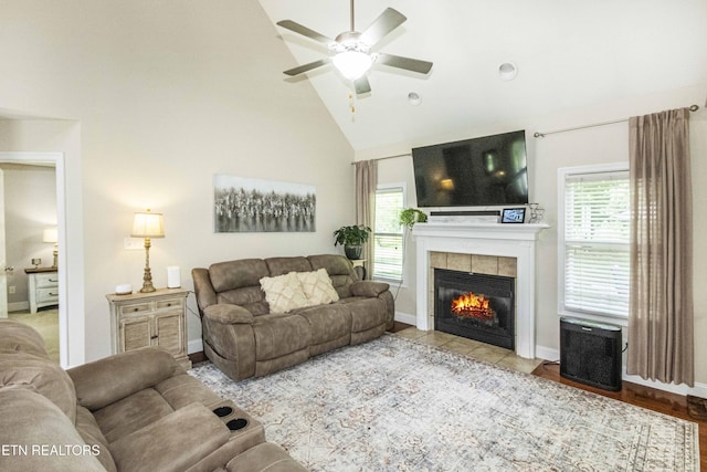 103 Branch Ln, Clinton, TN 37716 - living area with ceiling fan, a tiled fireplace, and high vaulted ceiling