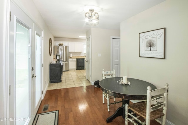 103 Branch Ln, Clinton, TN 37716 - dining area with light wood-style floors and baseboards