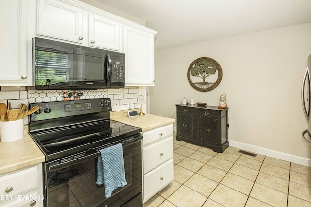 103 Branch Ln, Clinton, TN 37716 - kitchen with black appliances, backsplash, light countertops, white cabinets, and light tile patterned floors