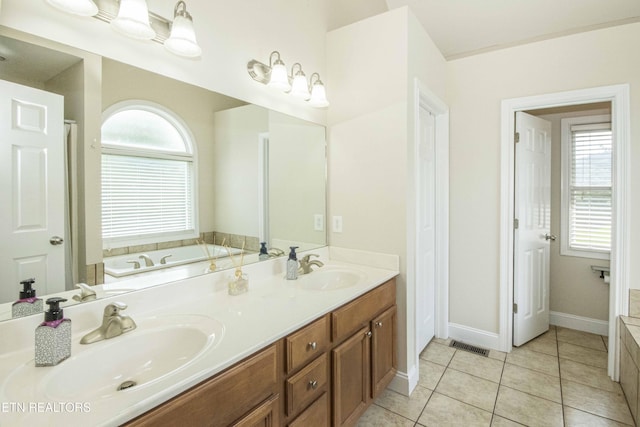 103 Branch Ln, Clinton, TN 37716 - bathroom with double vanity, a bath, and tile patterned floors