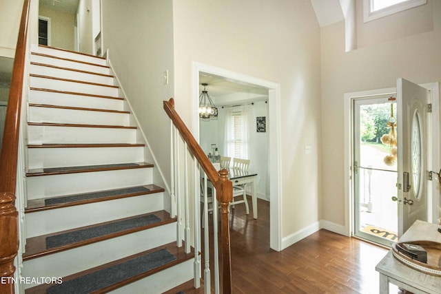 103 Branch Ln, Clinton, TN 37716 - entryway featuring dark wood-type flooring, stairway, a chandelier, and a high ceiling