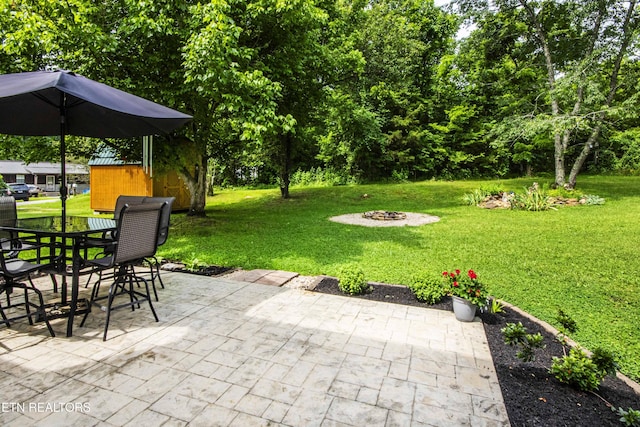 103 Branch Ln, Clinton, TN 37716 - view of patio / terrace featuring a fire pit, outdoor dining space, and a shed