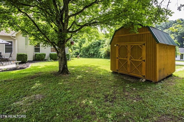 103 Branch Ln, Clinton, TN 37716 - view of grassy yard featuring a storage shed and a patio area
