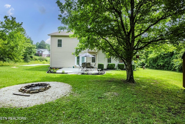 103 Branch Ln, Clinton, TN 37716 - view of green lawn featuring a fire pit and a patio