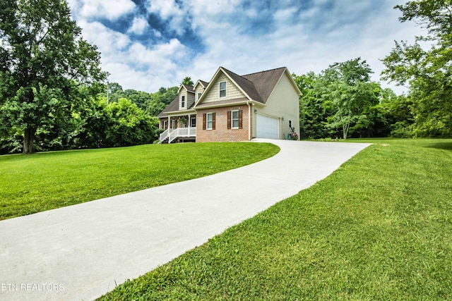 103 Branch Ln, Clinton, TN 37716 - view of front of home featuring brick siding, a garage, a front lawn, and driveway