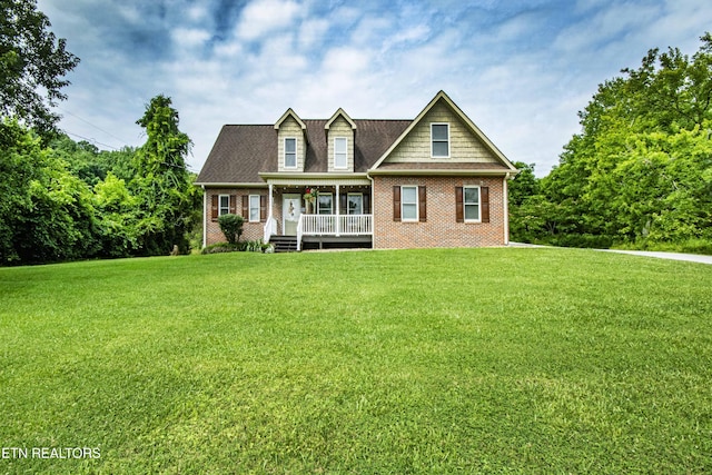103 Branch Ln, Clinton, TN 37716 - view of front facade featuring a porch, brick siding, and a front yard