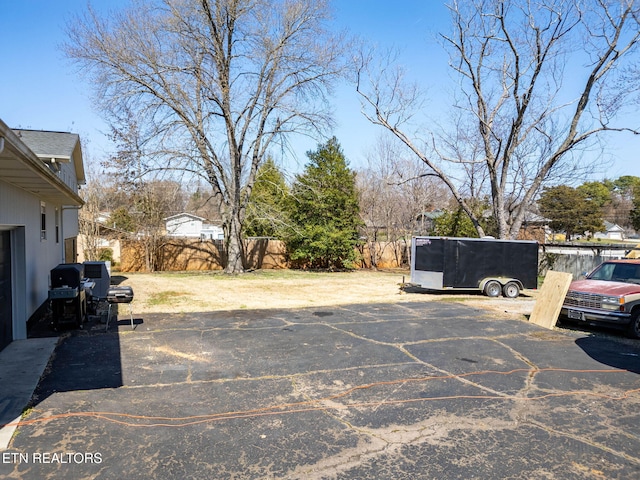 uncovered parking lot with fence