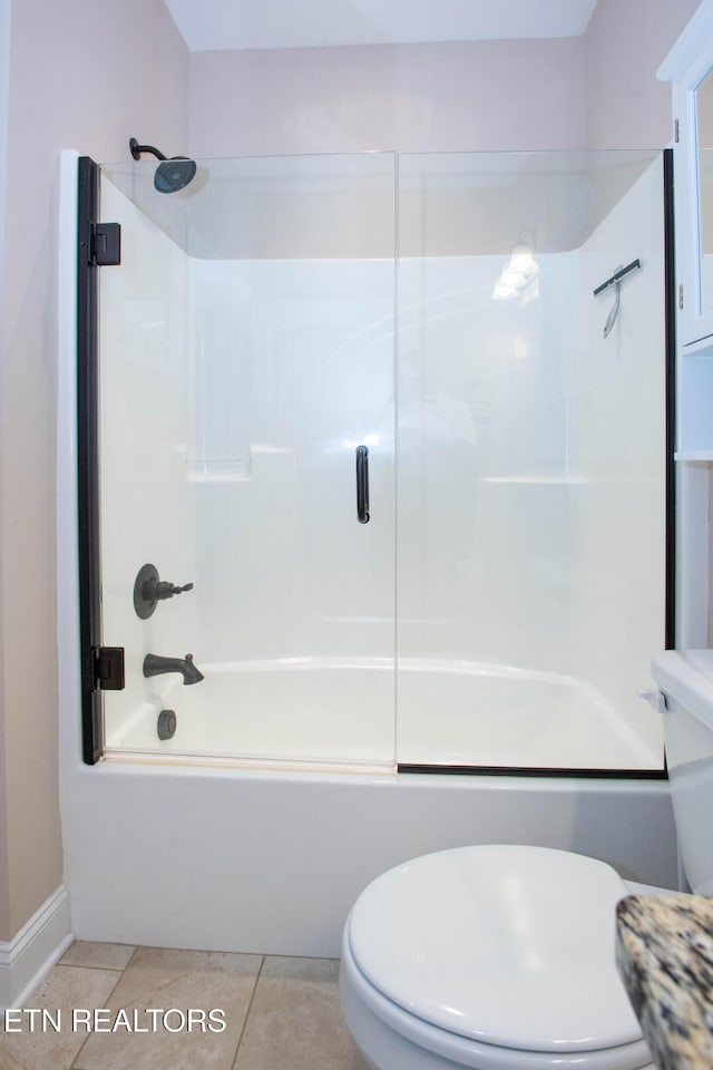 full bath with shower / bathing tub combination, toilet, and tile patterned floors