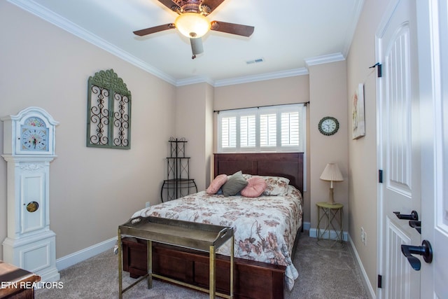 bedroom featuring ornamental molding, carpet flooring, visible vents, and baseboards