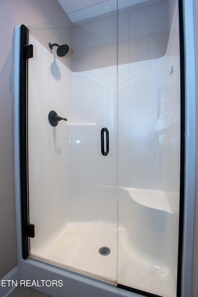 bathroom with a stall shower