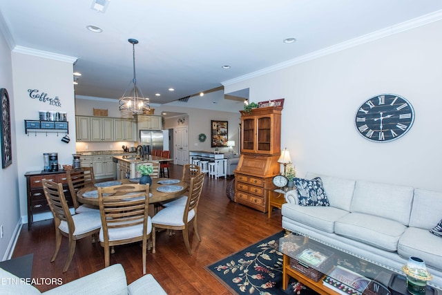 dining space featuring an inviting chandelier, crown molding, dark wood-style flooring, and recessed lighting