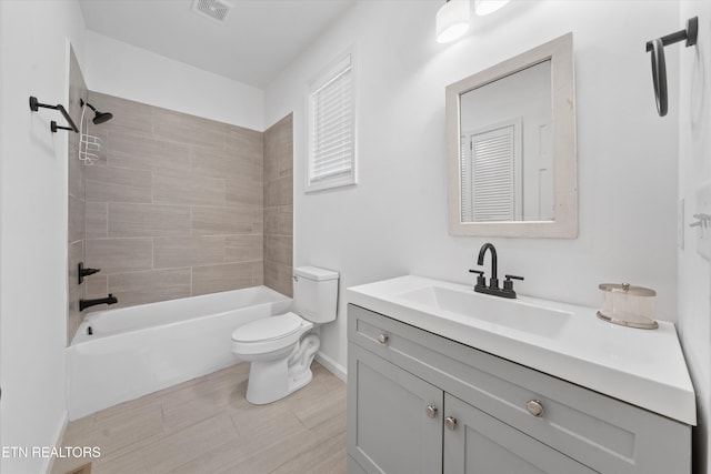 full bathroom featuring baseboards, visible vents, toilet,  shower combination, and vanity