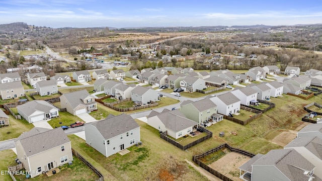 birds eye view of property with a residential view