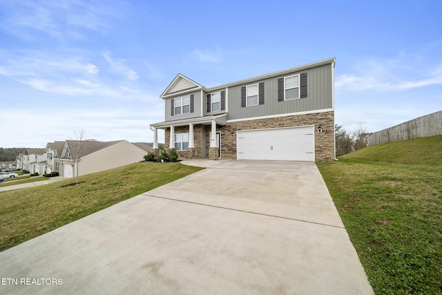 traditional-style home with a garage, driveway, and a front lawn