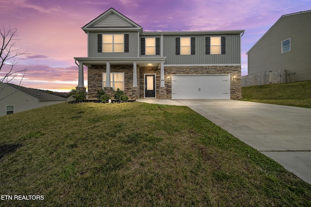 view of front facade with an attached garage, driveway, and a front yard