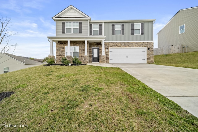 view of front of house with driveway, stone siding, a garage, and a front yard