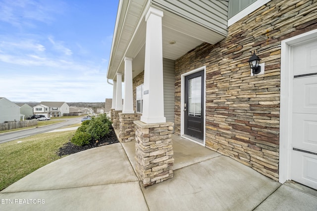 view of patio / terrace with a porch and a residential view