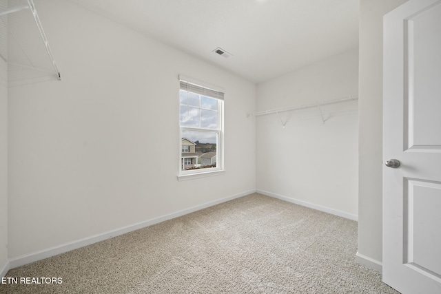 spacious closet featuring carpet floors and visible vents