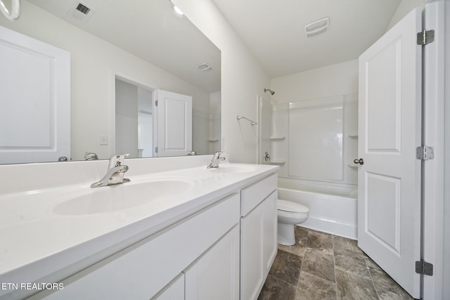 full bathroom featuring double vanity, visible vents, and a sink